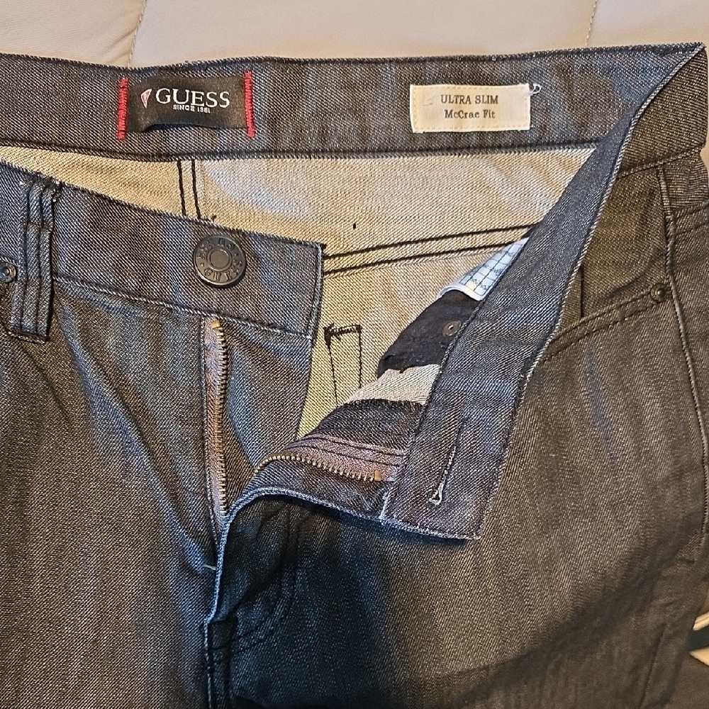 Guess Ultra Slim Dark Blue Jeans with black stitching.